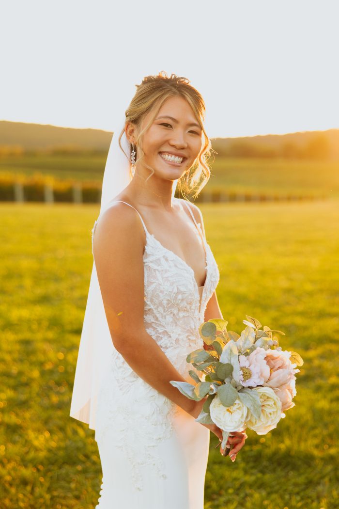 Bride wearing Alda wedding dress by Rebecca Ingram