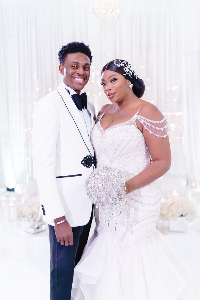 Groom with Curvy Bride Wearing Plus Size Wedding Dress Called Brinkley Lynette by Maggie Sottero