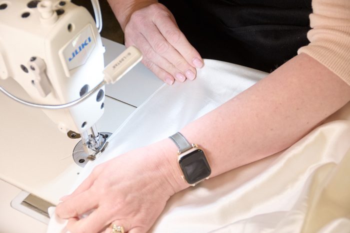 Seamstress doing wedding dress alterations