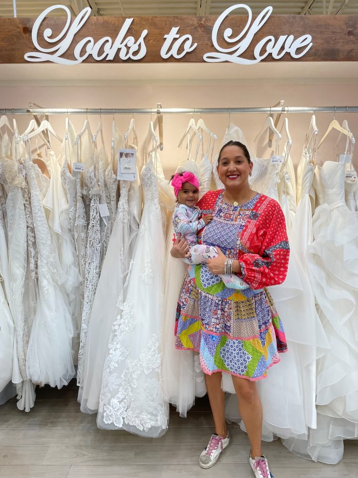 Ella Blu Bridal Boutique Owner Holding A Baby