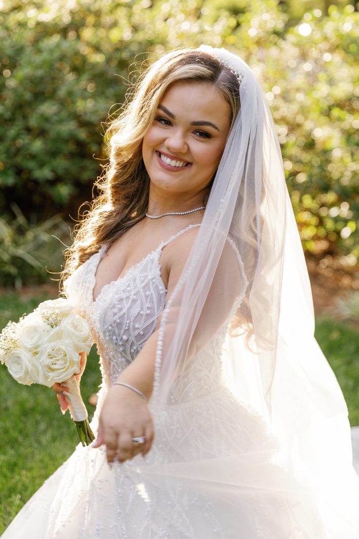 Lona, who is wearing one of Sottero and Midgley's A-line wedding dresses, Marvine