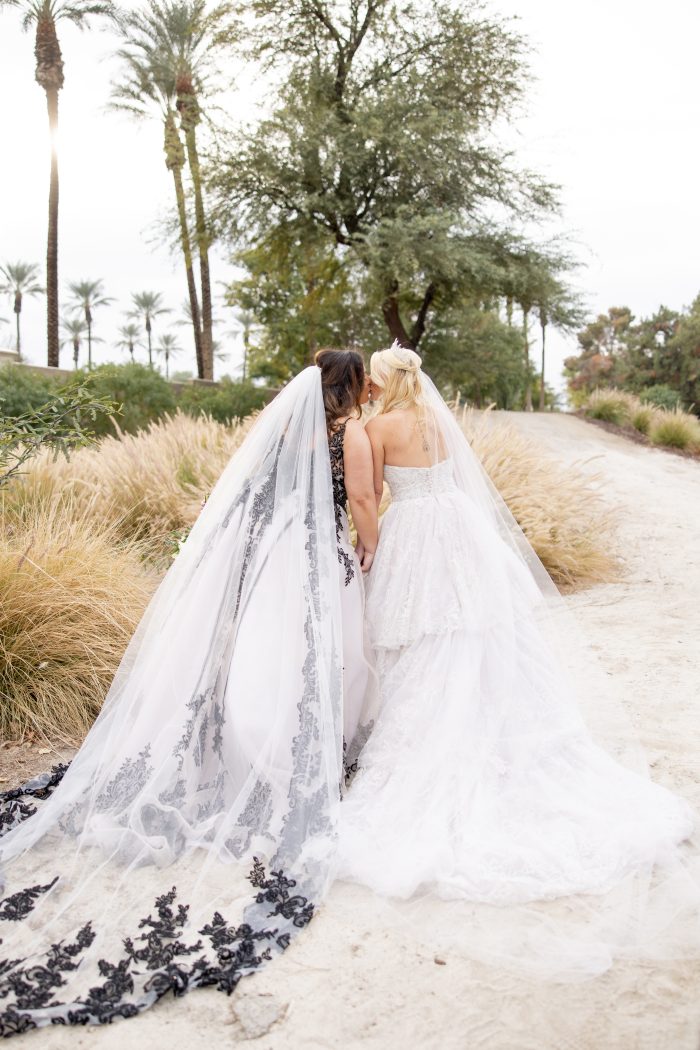 Brides Katie and Curly, wearing Tristyn wedding gown by Maggie Sottero, at their New Year's Eve wedding