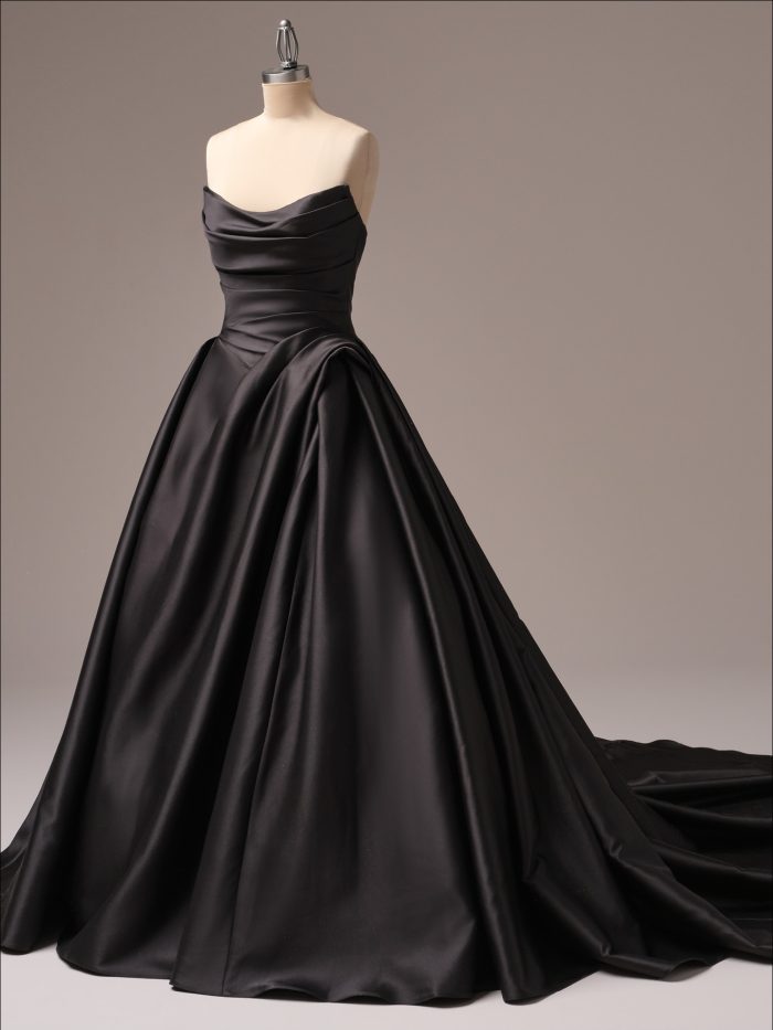 Antoinette black ballgown wedding dress by Maggie Sottero featuring a strapless draped satin bodice, full skirt, and sweeping train in luxe fabric.