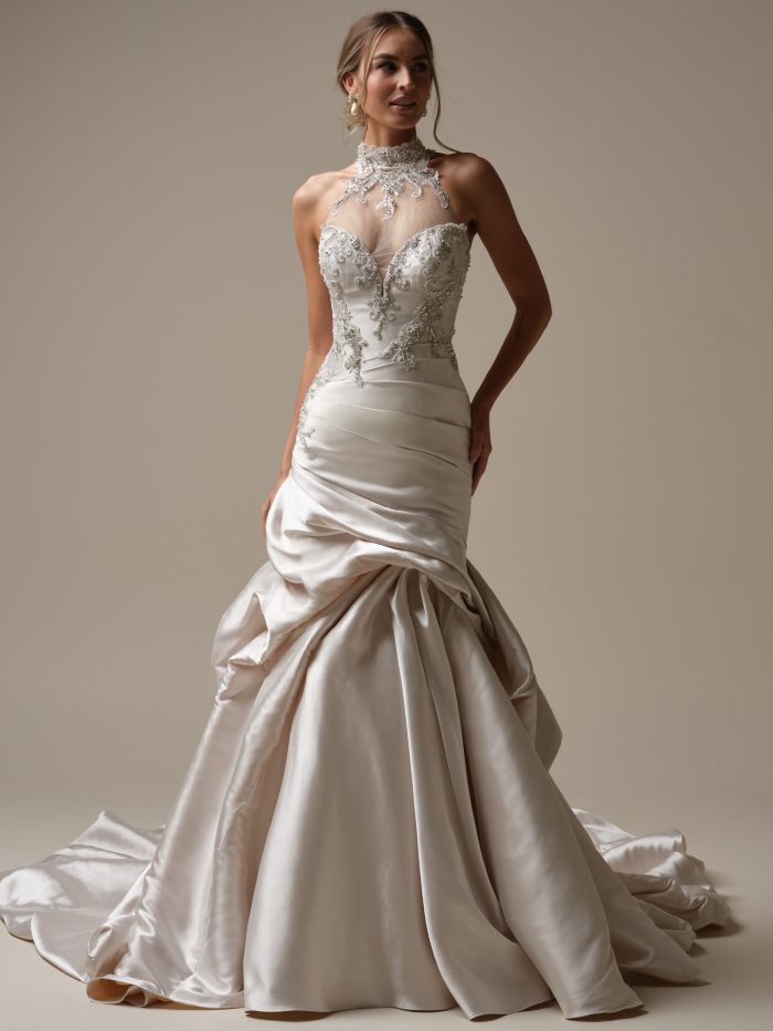 Bride wearing the Cressida by Maggie Sottero fit and flare wedding dress with a draped satin skirt and beaded bodice.