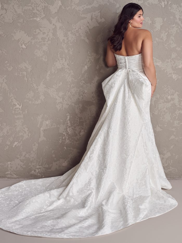 Bride wearing Hilo brocade wedding dress by Maggie Sottero