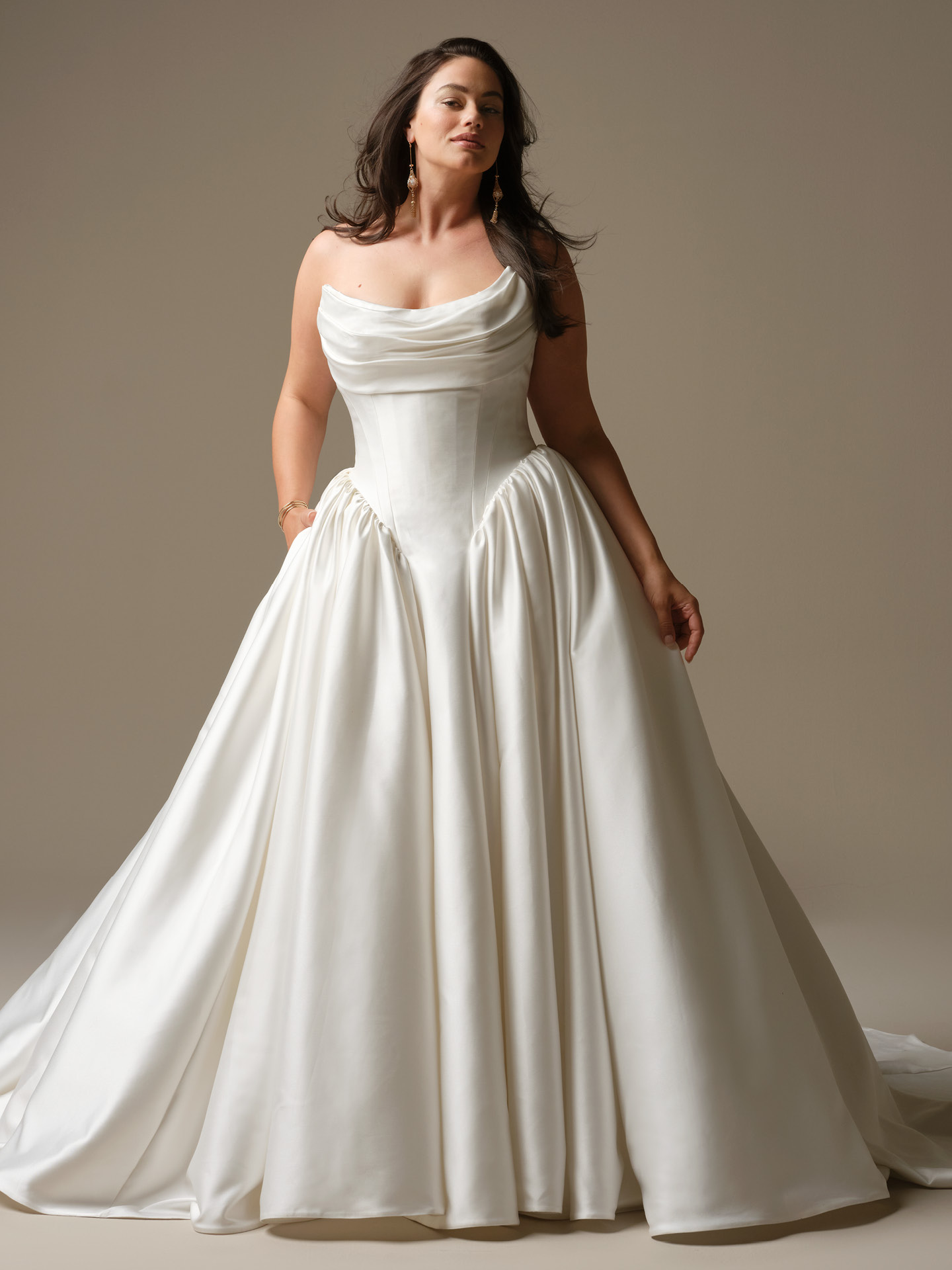 Hudson satin ballgown wedding dress featuring a strapless draped bodice, Basque waist, and full princess skirt in luminous ivory satin.