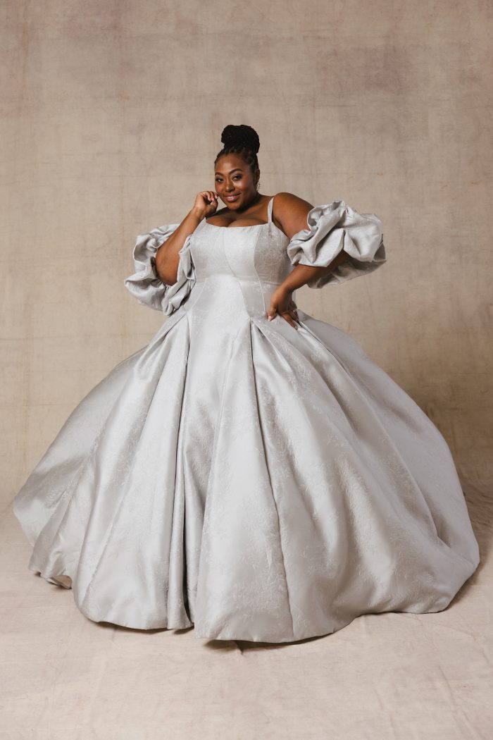 Curve bride wearing a floral jacquard princess ball gown wedding dress