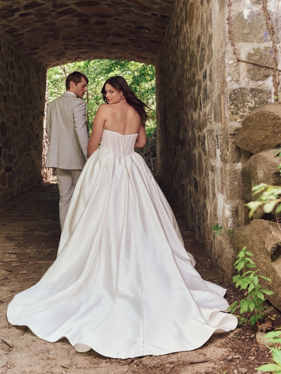 Bride wearing pearl wedding dress called Tina by Maggie Sottero