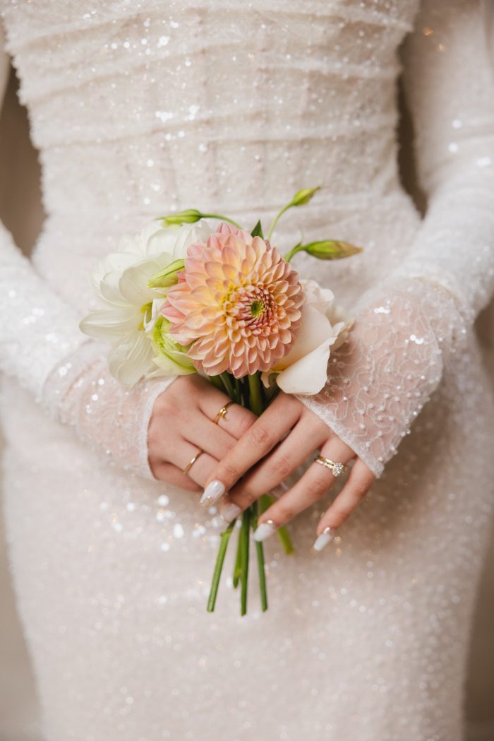 Bride holding a mini flower bouquet