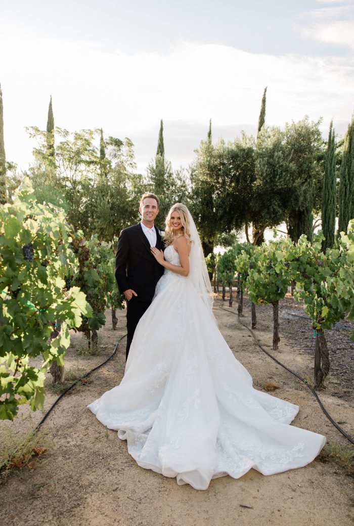 Bride wearing Norvinia wedding dress by Sottero and Midgley