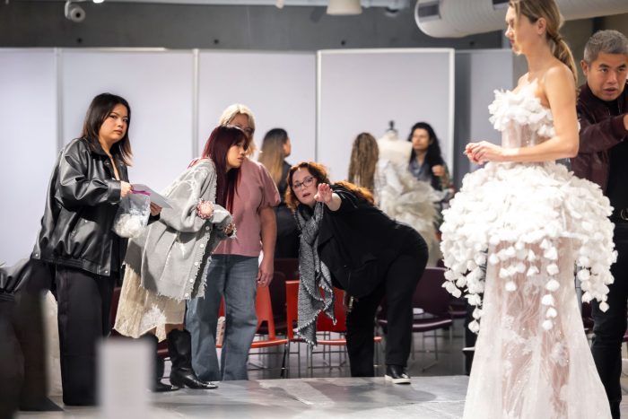 Model wearing a wedding dress designed by Otis students during upcycling mentorship project