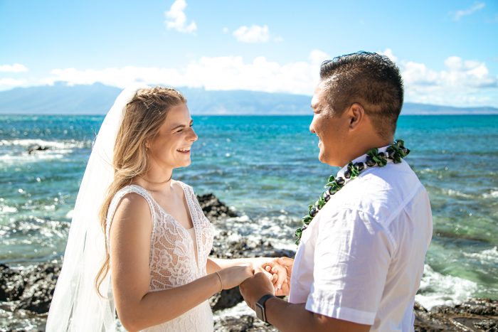 Bride and Groom Saying Vows During Beach Minimony