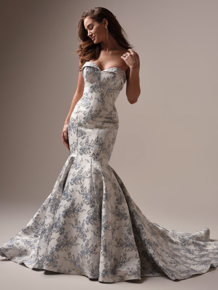 Bride wearing the Sottero and Midgley Aberdeen Lane fit-and-flare wedding dress in vintage-inspired floral jacquard, featuring a strapless sweetheart neckline with folded band detail and dramatic flared skirt.