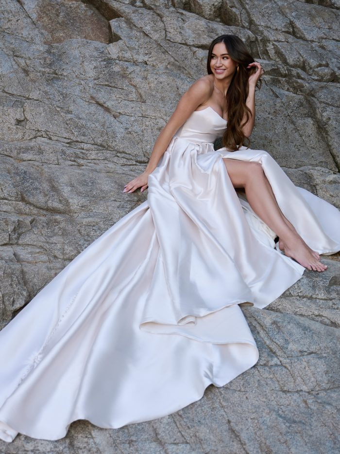 Bride wearing Aspen by Sottero and Midgley, a simple A-line Mikado wedding dress with a cat eye neckline