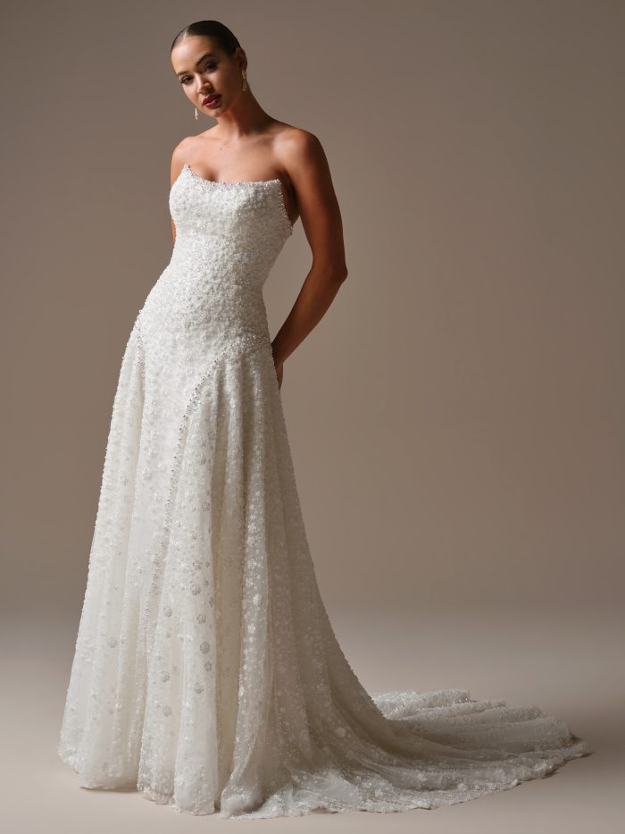 Front view of Sottero and Midgley Marceline A-line wedding dress featuring allover 3-D floral beading, strapless neckline, and chapel-length train.