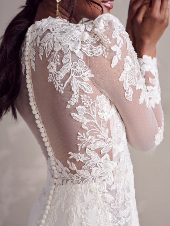 Bride wearing wearing an illusion back wedding dress with lace sleeves