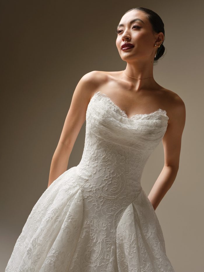 Close-up of the Tamar A-line wedding dress highlighting the textured lace bodice, delicate sweetheart neckline, and sculpted waistline flowing into the lace skirt.