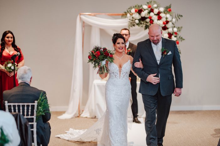 Bride wearing Tuscany Royale wedding gown by Maggie Sottero, which goes well with winter wedding themes