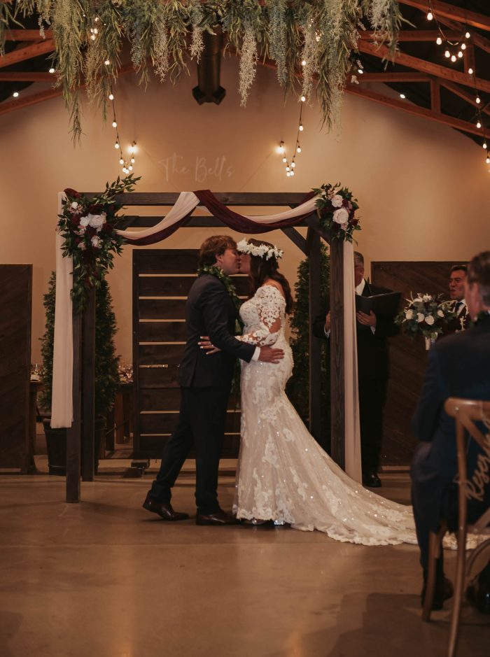 Bride wearing Tuscany Royale wedding gown by Maggie Sottero, which goes well with winter wedding themes