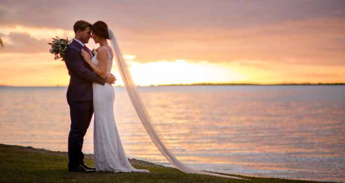 Couple on the beach during their destination wedding