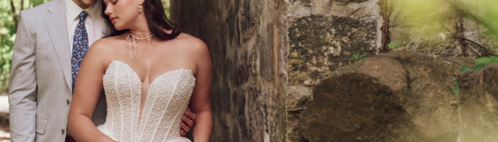 Bride wearing a drop waist wedding dress called Tina by Maggie Sottero with her husband