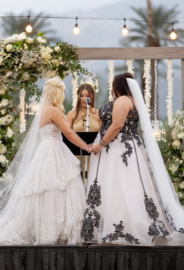 Brides Katie and Curly, wearing Tristyn wedding gown by Maggie Sottero, at their New Year's Eve wedding