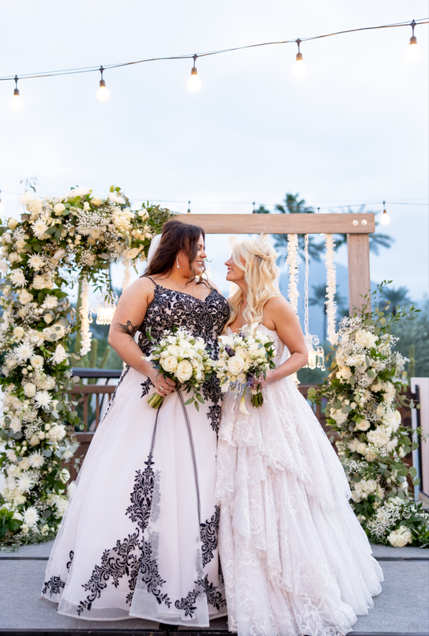 Brides Katie and Curly, wearing Tristyn wedding gown by Maggie Sottero, at their New Year's Eve wedding