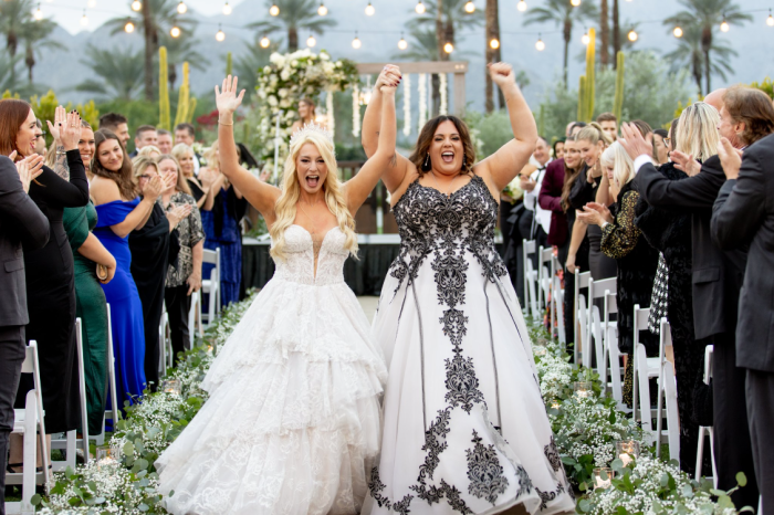 Brides Katie and Curly, wearing Tristyn wedding gown by Maggie Sottero, at their New Year's Eve wedding