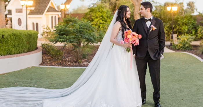 Bride smiling at groom wearing a sparkly A-line wedding dress